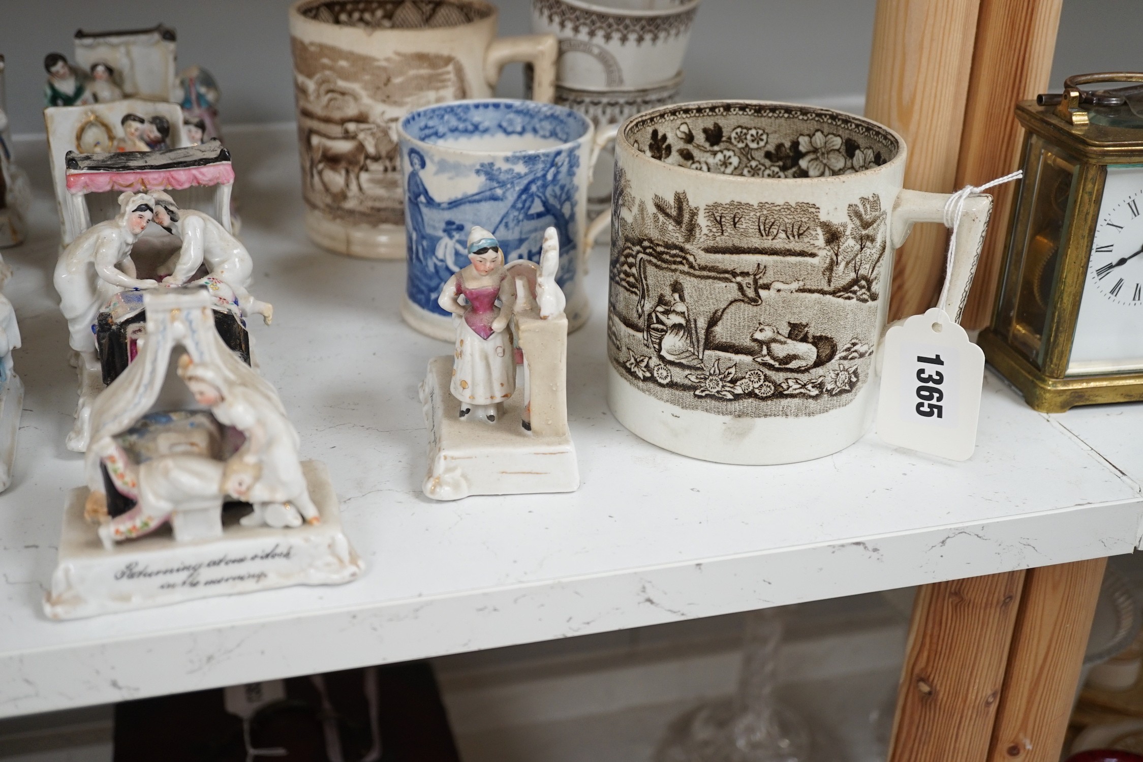 A collection of German porcelain Fairings, including Possneck, and four printed creamware mugs and a cup